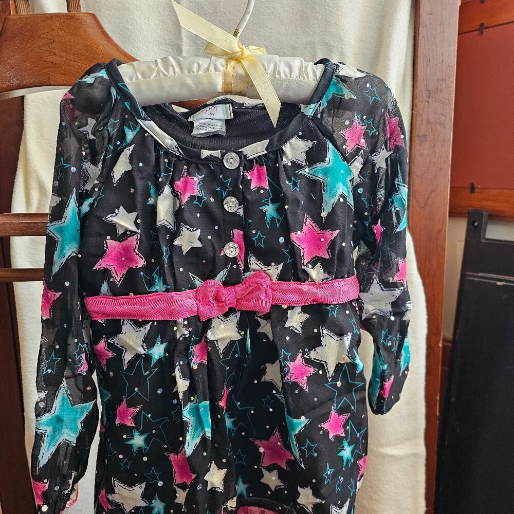 Super cute sparkly 4T long-sleeve star top with bow accent. Excellent used condi